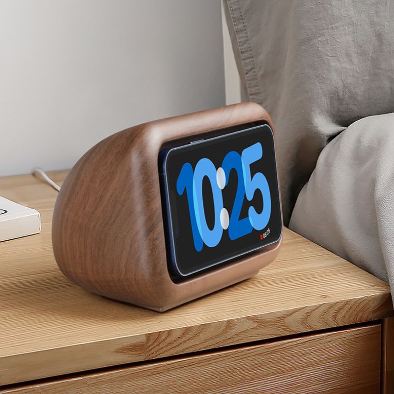 Wooden digital clock with blue LED display on a white background