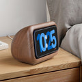 Wooden clock with digital display on a wooden surface