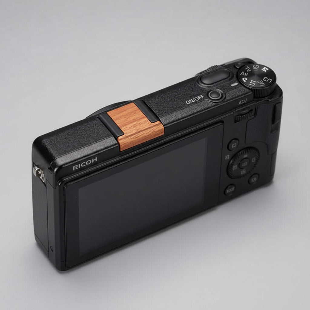 Ricoh GR4 Hotshoe Cover Wood iWoodStore Black lighter with wooden accent on a dark textured surface