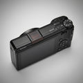 Ricoh GR4 Hotshoe Cover Wood iWoodStore Black Ricoh camera on a dark wooden surface