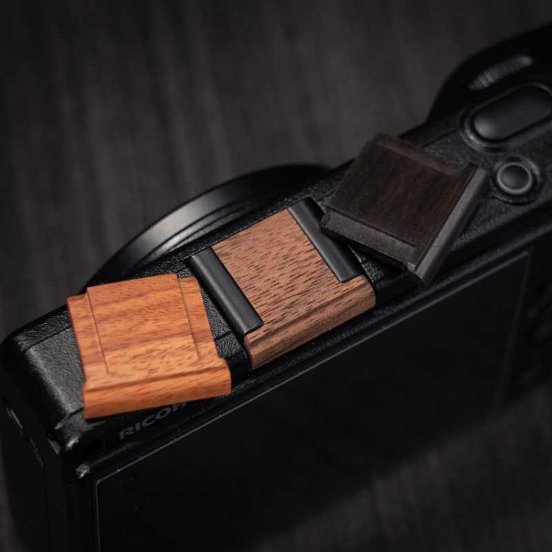 Ricoh GR4 Hotshoe Cover Wood iWoodStore Camera with wooden and black leather straps on a dark background