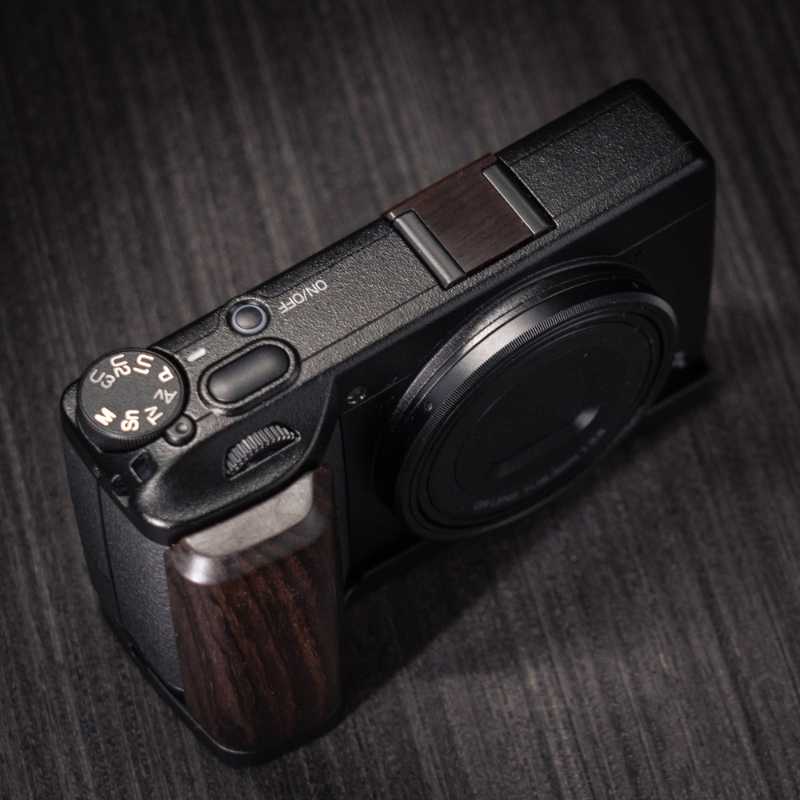 Ricoh GR4 Hotshoe Cover Wood iWoodStore Camera with wooden accents on a dark textured surface