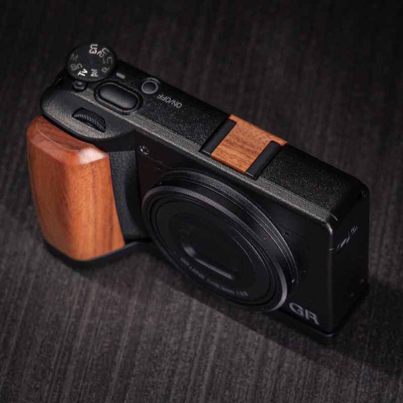Ricoh GR4 Hotshoe Cover Wood iWoodStore Camera with wooden grip on a dark textured surface