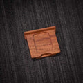 Ricoh GR4 Hotshoe Cover Wood iWoodStore Wooden square object on a textured dark surface