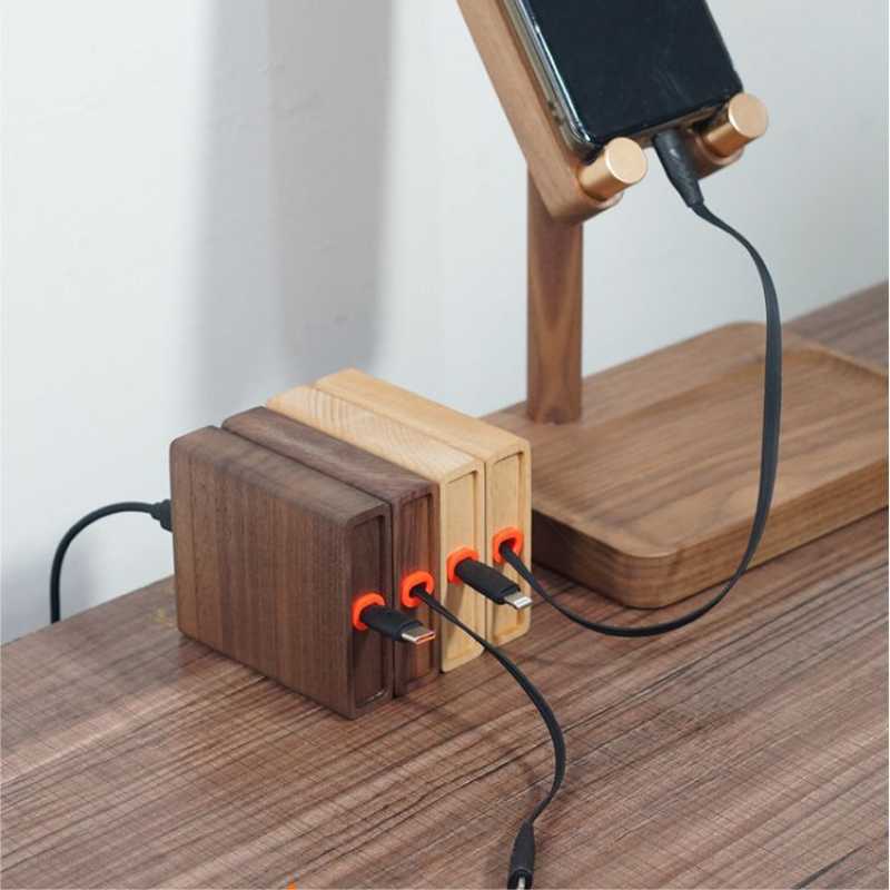Wood Telescopic Retractable Data Cable Charging Cable For Desk iWoodStore Wooden charging station with multiple ports on a wooden surface