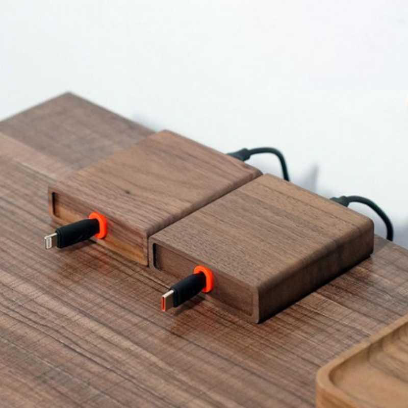 Wood Telescopic Retractable Data Cable Charging Cable For Desk iWoodStore Wooden USB drives with black and orange connectors on a wooden surface